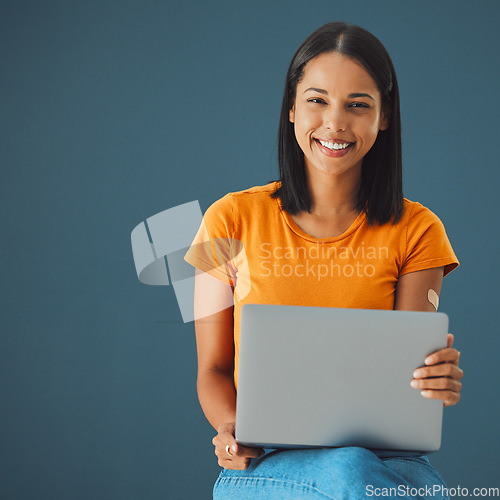 Image of Laptop, woman and smile in portrait with mockup space, communication and technology isolated on studio background. Email, blog and copywriting with writer, happy person and connectivity with website