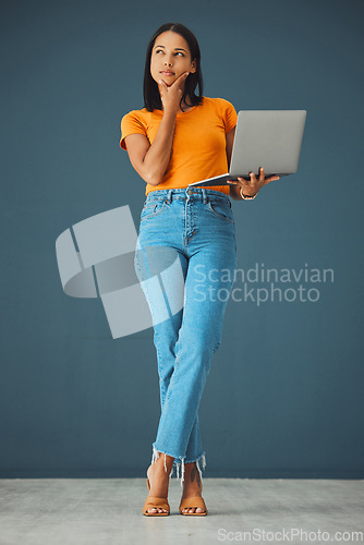 Image of Laptop, thinking and woman in studio with emoji and gesture as a student against grey background. Idea, girl and contemplation while online for advertising, mockup and space while posing isolated