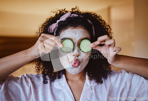Image of Cucumber, eyes and skincare facial for black woman in a bedroom, grooming and having fun with treatment. Face, mask and girl relax with fruit product, hygiene and beauty routine, happy and playful