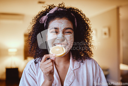 Image of Orange, skincare and portrait of woman eating in bedroom for wellness, grooming or facial. Fruit, face and girl relax with citrus, natural and skin, detox and diet, happy and smile for vitmain c