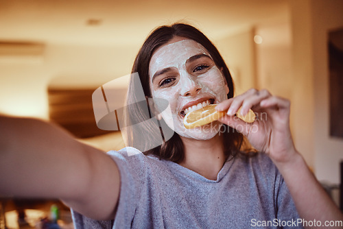 Image of Selfie, portrait and woman eating orange during skincare, beauty and grooming in bedroom, happy and smile. Face, vitamin c and girl influencer relax with fruit facial, mask or detox treatment at home