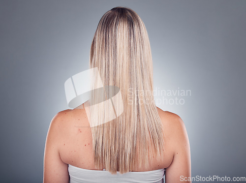 Image of Grooming, beauty and woman with long blond hair due to salon care or cosmetic shampoo isolated in studio grey background. Treatment, balayage and girl with healthy shine and glow due to keratin