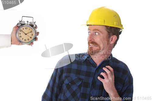 Image of construction worker looking at his watch