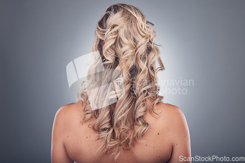 Image of Hair care, beauty and woman with curly hairstyle texture after salon treatment in a studio. Gray background, isolated and model with hairdresser balayage, dye and growth from haircut and keratin