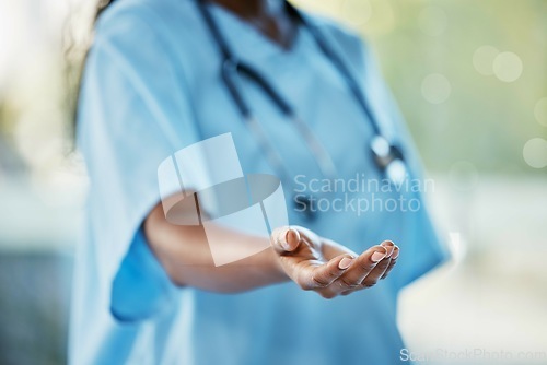 Image of Healthcare, doctor or nurse with helping hand giving support, health care and volunteer work in hospital in Africa. Black woman medical worker, stethoscope and hands in trust working charity clinic.