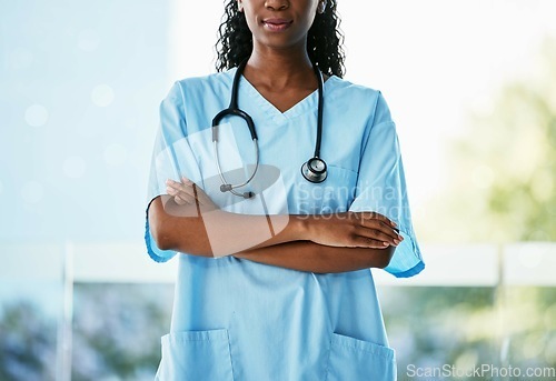 Image of Healthcare, leadership and African doctor with crossed arms and stethoscope standing in garden. Confidence, leader and professional black woman medical worker in medicare hospital after consultation.