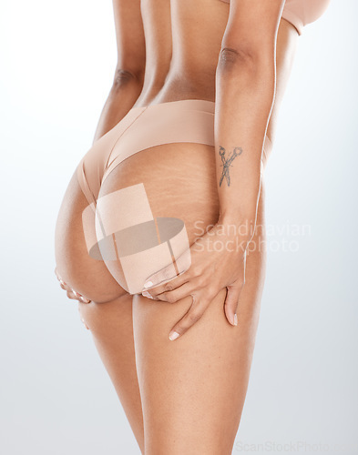 Image of Woman underwear, hands or lifting butt in bum surgery, cellulite goal or stretch mark solution for body liposuction. Zoom, lingerie or model panties on isolated studio background in weight loss check