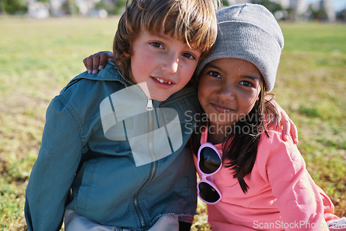 Image of Friends, portrait and kids hug at park while bonding, smile and having fun together outdoors. Diversity, care and children hugging, cuddle and embrace while enjoying quality time on holiday vacation.