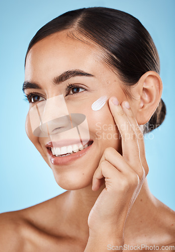 Image of Beauty, face and skincare for a woman with hand for dermatology, cosmetics and natural glow. Aesthetic model person happy about spa facial self care results for health and wellness on blue background