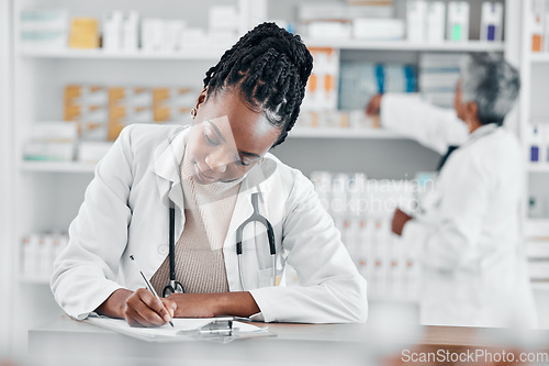 Image of Healthcare, insurance and pharmacist writing notes for medicine, stock checklist and inventory. Pharmacy, working and black woman with a document for clinic pills, product and medical information