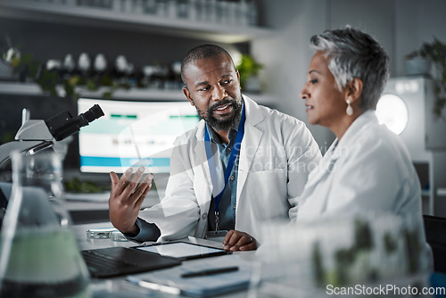 Image of Lab discussion, tablet and science teamwork for research at desk with data analytics for plants, goal or growth. Mature scientist woman, mobile touchscreen ux or black man with agriculture innovation