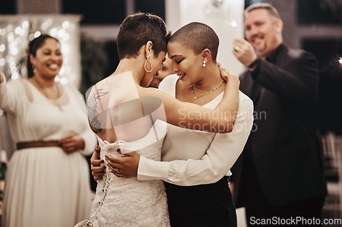 Image of Wedding, love and dance with a lesbian couple in celebration of their union together at a ceremony of tradition. LGBT, woman or diversity with a female and partner dancing after being married