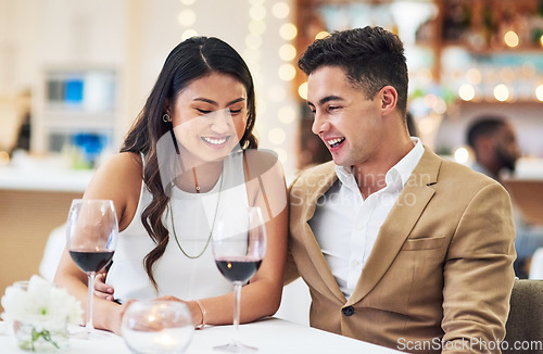 Image of Love, couple and in restaurant with smile, celebration and quality time together, happiness and affection. Romance, man and woman with fine dining, wine glasses and romantic with bonding and loving