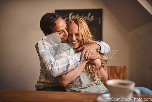 Image of Love, couple and quality time at a cafe, hug and happiness together, romance and celebrate achievement. Valentines day, man and woman with smile, romantic and in coffee shop for break, relax or happy