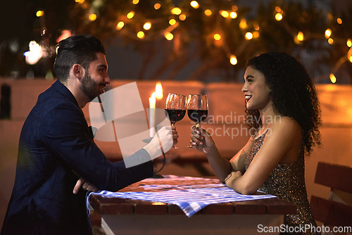 Image of Love, wine and toast of couple on date for fine dining, restaurant or night valentine celebration together. Happy black woman with romance partner alcohol glass, celebrate and luxury in night bokeh