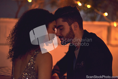 Image of Love, passion and interracial couple on a date at a restaurant for nightlife, valentines day and city bonding. Care, embrace and man and woman with gratitude, calm and romance in Italy at night