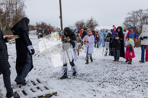 Image of People attend the Slavic Carnival Masopust