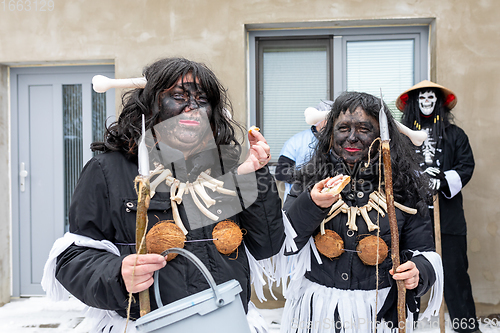 Image of People attend the Slavic Carnival Masopust