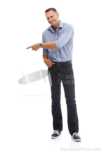 Image of Portrait, pointing and mockup with a man in studio isolated on a white background for branding or product placement. Point, mock up and advertising with a male on blank space to point at a brand