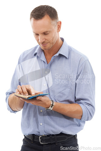 Image of Notebook, schedule and agenda with a man in studio isolated on a white background reading notes. Book, note and planner with a handsome mature male on blank space checking his journal or diary