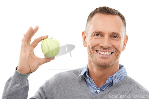 Image of Man, studio portrait and apple in hands for health, diet and wellness isolated on a white background. Model person with nutrition vegan fruit food for a healthy lifestyle, motivation and clean eating