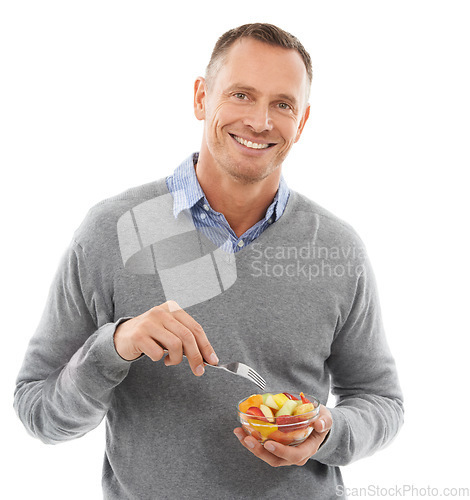 Image of Portrait, studio and man eating a fruit salad for a healthy snack, diet meal or craving. Happy, smile and male model enjoying fresh produce for health and wellness isolated by white background.