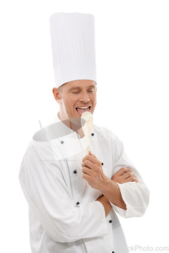 Image of Man, chef licking wooden spoon and goofy cafe owner and small business in restaurant industry isolated on white background. Happy cook, discount deal and delicious menu special or promotion in studio