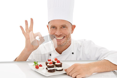 Image of Perfect, sign and dessert chef happy with dish or sweet chocolate flavor with hand gesture isolated in studio white background. Portrait, smile and plate of food by a culinary cook with mini cakes