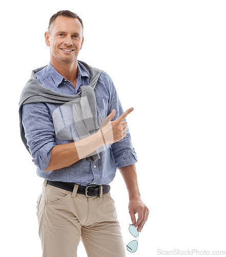 Image of Man, portrait and pointing for product placement standing isolated against a white studio background. Happy male with smile showing gesture or pointed finger in presenting for advertisement on mockup