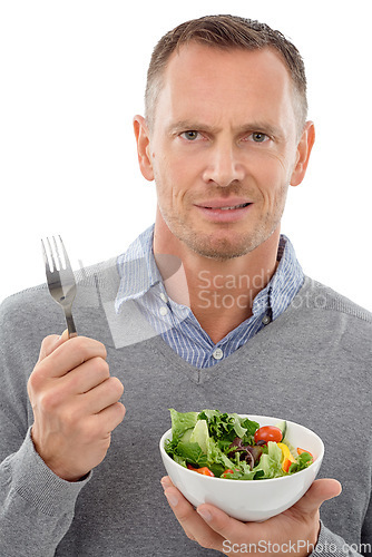 Image of Man, salad and vegetables studio portrait with disgust for healthy food with nutrition for health. Model person with vegan lunch or brunch bowl isolated on a white background with a fork for wellnes