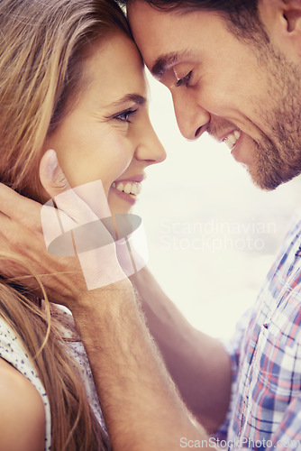 Image of Happy couple, bonding and forehead touch on love date, valentines day or romance in nature break, park or relax garden. Man, woman or face smile in intimate trust, security hug or thank you support