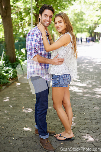 Image of Happy couple, hug or bonding portrait on love date, valentines day or romance in nature park or relax garden. Smile, man or woman embrace in girlfriend trust, boyfriend security and honeymoon support