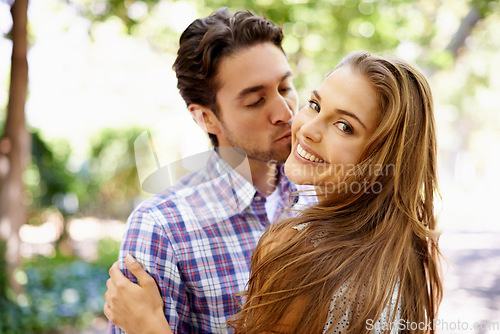 Image of Couple love, portrait or cheek kiss embrace on valentines day, romance date or bonding in nature park or relax garden. Zoom, hug or kissing man and happy woman in trust, security or thank you support