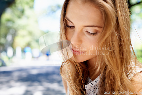 Image of Woman, face and outdoor in park with travel and nature, peace and content with mockup space and beauty. Dream, thinking and zen with mindfulness, young female in Boston with closeup and adventure