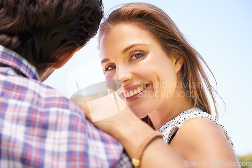 Image of Couple, portrait or hug on love bench in nature park bonding or city garden on valentines day, romance date or low angle. Smile, happy woman or man on outdoor seat embrace or relax wooden furniture