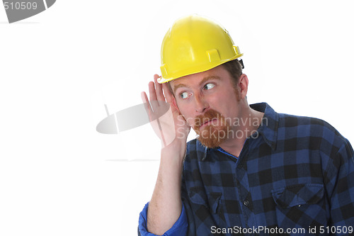 Image of construction worker with hand on ear 