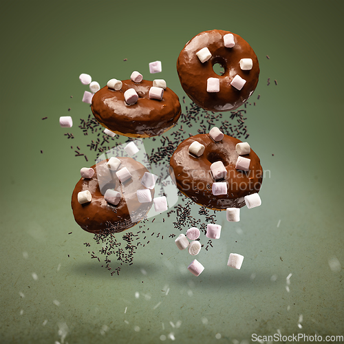 Image of Flying chocolate glazed doughnuts