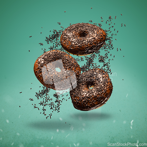 Image of Sweet chocolate doughnuts, flying