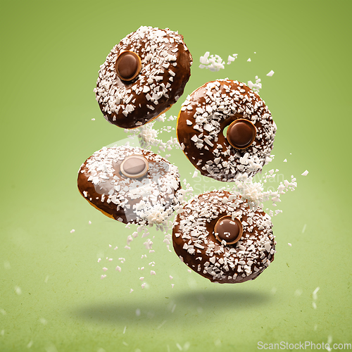 Image of Flying chocolate glazed donuts