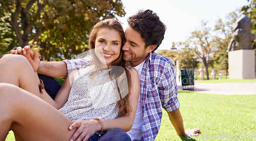 Image of Couple, portrait or bonding on picnic date, valentines day or love break in nature park, garden or backyard romance. Smile, happy or man and woman in relax trust, security or support on green grass