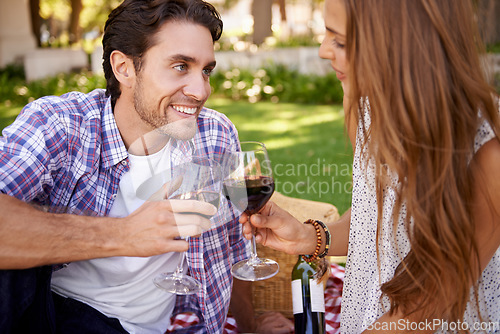 Image of Happy couple, love and wine toast for picnic, valentines day or romance date bonding in nature park or garden grass. Smile, woman and man and alcohol drinks glass in marriage anniversary celebration
