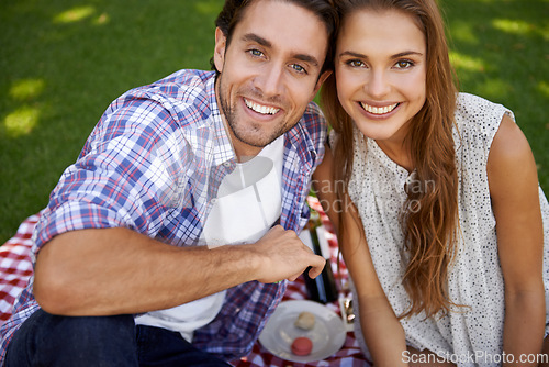 Image of Portrait, picnic and date with a couple in a park together during summer for love, romance or bonding. Face, nature or dating with a young man and woman in a garden for a romantic celebration