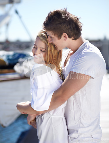 Image of Romantic, happy and couple with a hug at the harbor for a date on valentines day in summer in Italy. Love, embrace and content man and woman hugging during an anniversary at a port for romance