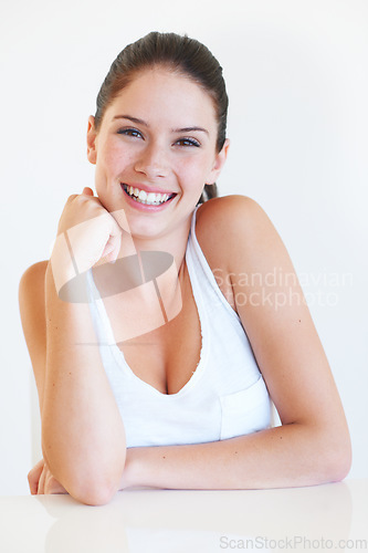 Image of Beauty, woman and portrait of a young model with smile and happiness in a studio. Cashion fashion, skin glow and happy person with isolated white background feeling relax and calm with wellbeing