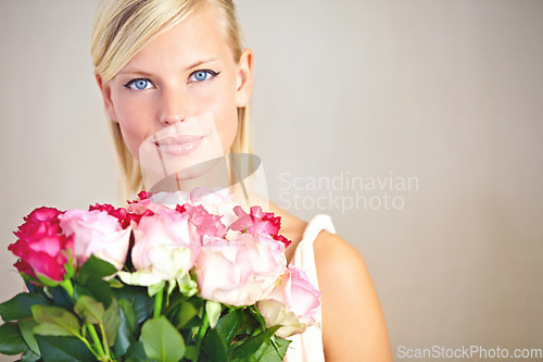 Image of Portrait, mockup and woman with bouquet roses, smile and gift for Valentines day, happiness and studio background. Face, female or lady with flowers, love and joyful with peace or romance on backdrop