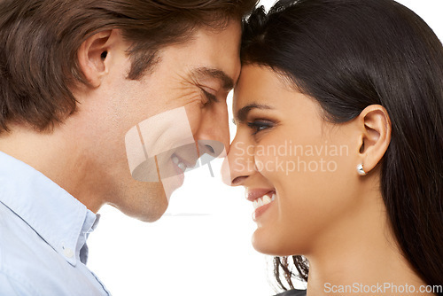 Image of Couple, forehead and smile for love, valentines day or date in affection isolated against white studio background. Closeup of man and woman smiling touching heads embracing special month of romance