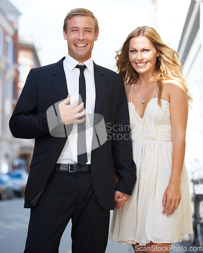 Image of City date, valentines love and couple portrait with a smile ready for romance and happiness on a street. Suit, smile and happiness of a fancy woman and man together with care on dates for engagement