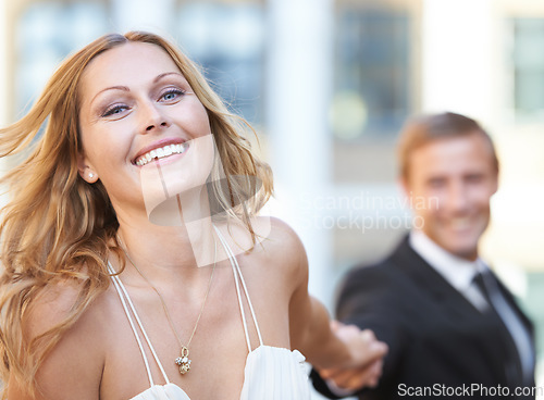 Image of Portrait, woman and man holding hands with smile in city, celebration and Valentines day with joy. Face, couple touch hand or dressed up with elegant outfit, happiness and affection outdoor with love