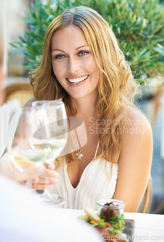 Image of Toast, woman and champagne for couple at a restaurant for valentines day, love and celebration. Wine, toasting and cheers from lady to man on first date, romance or anniversary while celebrating