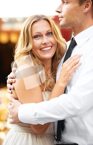 Image of Love, couple and hug at party, smile and celebration for wedding, relationship and happiness for romance. Portrait, man and woman embrace, romantic or excited for marriage, loving or bonding together